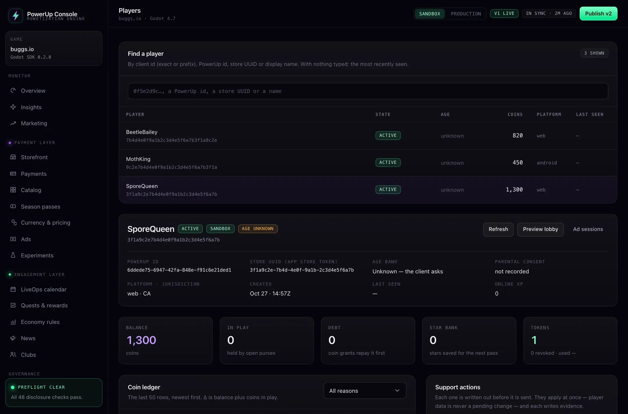 The PowerUp console Players page: a search box, three sandbox players, and one player's detail with PowerUp id, store UUID, age band unknown, parental consent not recorded, balance, coins in play, debt, star bank and tokens